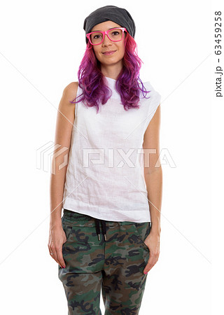 Studio shot of young beautiful woman standing and wearing pink e 63459258