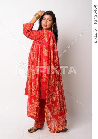 Full body shot of young Persian woman in traditional clothing 63459400