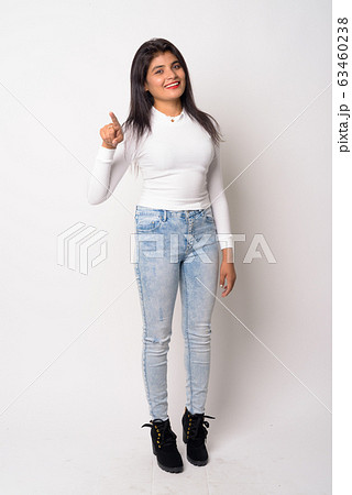 Full body shot of happy young Persian woman pointing at camera Full body shot of happy young Persian woman pointing at camera 63460238