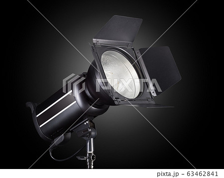 Photography studio flash isolated on black background with lamp. 63462841