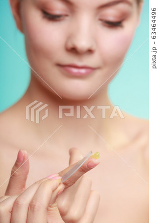 woman applying balsam for lips woman applying balsam for lips 63464496