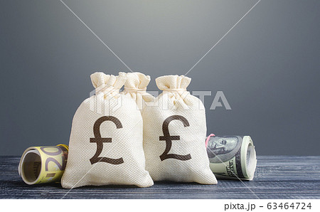 Pound sterling money bags. Capital investment, savings. Economics, lending business. Banking service, monetary policy. Reserve currency. Profit income, dividends. Crowdfunding startups investing. Pound sterling money bags. Capital investment, savings. Economics, lending business. Banking service, monetary policy. Reserve currency. Profit income, dividends. Crowdfunding startups investing. 63464724