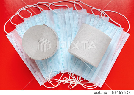 Top view of rolls toilet paper on background antiviral face masks and red color backdrop. World pandemic insurance, coronavirus Top view of rolls toilet paper on background antiviral face masks and red color backdrop. World pandemic insurance, coronavirus 63465638
