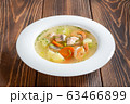 Plate of seafood soup with shrimps and salmon 63466899