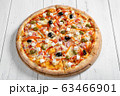 Fresh italian vegetarian pizza on wooden table 63466901