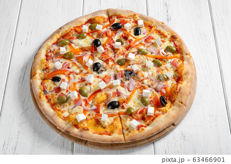 Fresh italian vegetarian pizza on wooden table 63466901