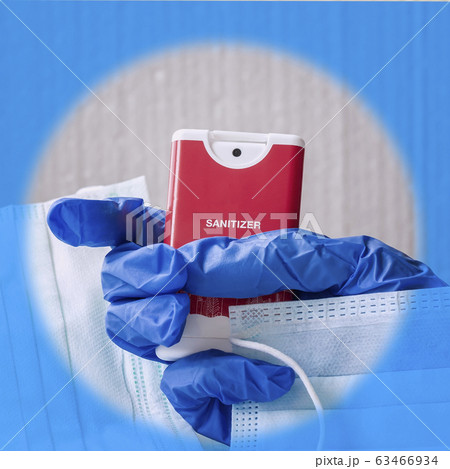 Personal sanitizer gel in a hand for cleaning, hygiene and protect from virus infection 63466934