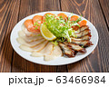 Mixed fish plate on wooden table. Cold starter. 63466984