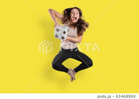 Young woman with toilet paper rolls on white background. Covid-19 panic shopping Young woman with toilet paper rolls on white background. Covid-19 panic shopping 63468969