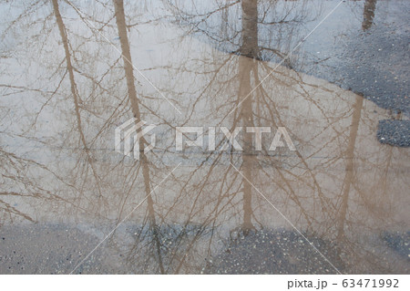 The bad asphalted road with a big pothole. Roadbed 63471992