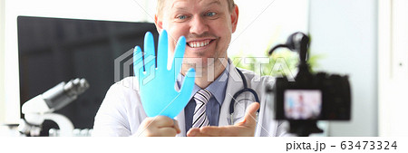 Smiling cheerful doctor Smiling cheerful doctor 63473324