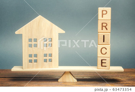 Wooden house and the word Price on the scales. Fair valuation property concept. Home appraisal. Fair trade and cost. Legal transparent deal. Business and real estate Wooden house and the word Price on the scales. Fair valuation property concept. Home appraisal. Fair trade and cost. Legal transparent deal. Business and real estate 63473354