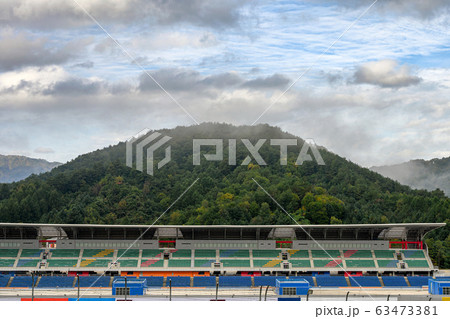 Stadium seats in the racetrack with fog on 63473381