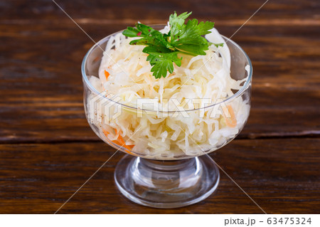 Fermented cabbage with parsley in glass cremana 63475324
