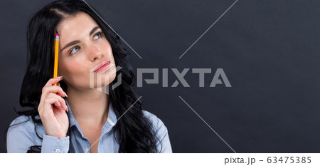 Young woman in a thoughtful pose 63475385