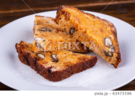 Pastries, muffins with nuts and raisins 63475596