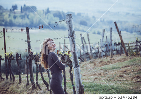 girl looking at the tuscanian landscape girl looking at the tuscanian landscape 63476284