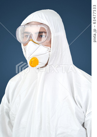Doctor in protective workwear and face mask 63477533