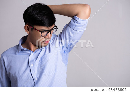 Close up asian man with hyperhidrosis sweating. Close up asian man with hyperhidrosis sweating. 63478805