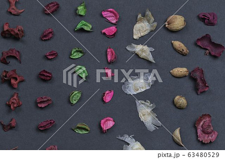 Potpourri on a black background. Flavored potpourri leaves. Dry potpourri leaves close-up. Geometric pattern. Potpourri on a black background. Flavored potpourri leaves. Dry potpourri leaves close-up. Geometric pattern. 63480529