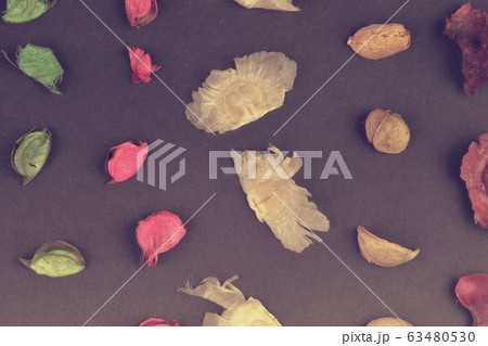 Potpourri on a black background. Flavored potpourri leaves. Dry potpourri leaves close-up. Geometric pattern. Closeup. Potpourri on a black background. Flavored potpourri leaves. Dry potpourri leaves close-up. Geometric pattern. Closeup. 63480530