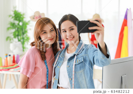 Fashion designers smiling and selfie their Fashion designers smiling and selfie their 63482212