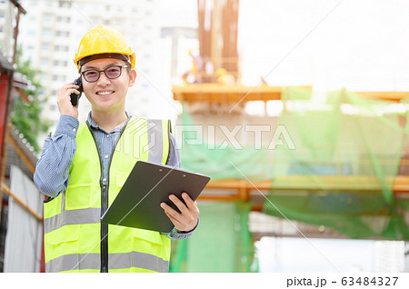 Young asian engineers are working on the construction site Young asian engineers are working on the construction site 63484327