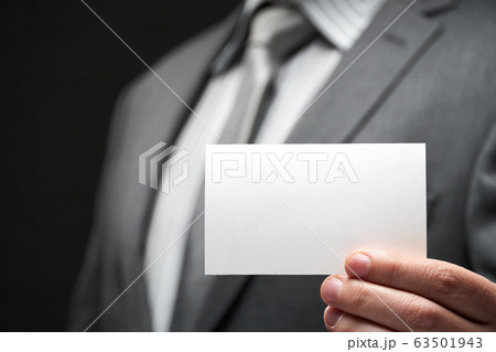 white blank business card closeup in businessman 63501943