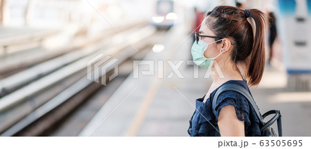 young Asian woman wearing Surgical face mask young Asian woman wearing Surgical face mask 63505695