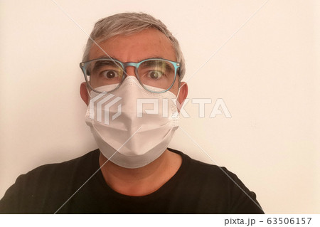 man wearing coronavirus mask man wearing coronavirus mask 63506157