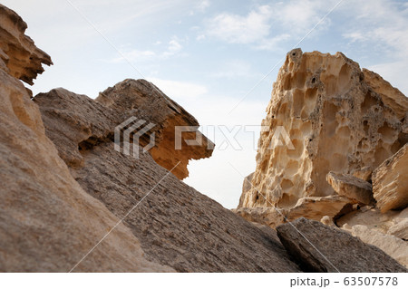 Cliffs by the sea. 63507578
