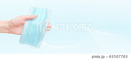 Medical mask in human hand. Banner design with abstract line background and clean space for your text 63507763