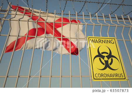 Coronavirus warning sign on the barbed wire fence against flag of Alabama. COVID-19 quarantine related 3D rendering 63507873