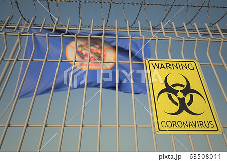 Biohazard coronavirus sign on the barbed wire fence near flag of Minnesota. COVID-19 quarantine related 3D rendering Biohazard coronavirus sign on the barbed wire fence near flag of Minnesota. COVID-19 quarantine related 3D rendering 63508044