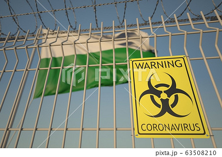 Biohazard coronavirus sign on the barbed wire fence near flag of Saxony, a state of Germany. COVID-19 quarantine related 3D rendering 63508210