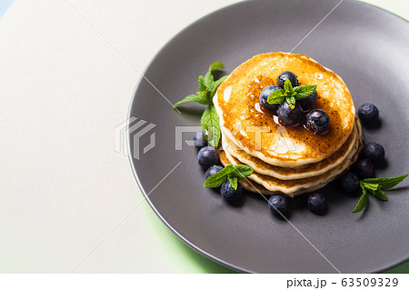 Stack of home made pancakes with fresh berries 63509329