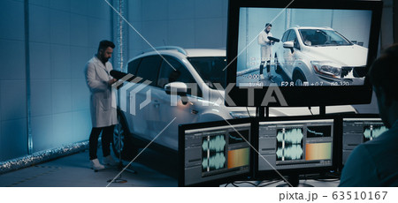 Engineers working in test chamber Engineers working in test chamber 63510167