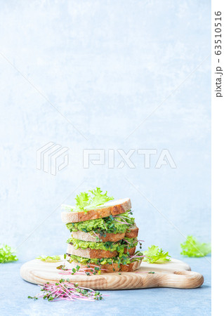Avocado and green sprouts salad sandwiches, 63510516
