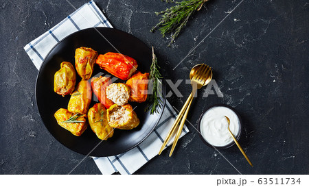 Homemade baked bell peppers stuffed with rice Homemade baked bell peppers stuffed with rice 63511734