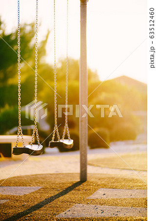 Children's swings on the chain in the park  63512460