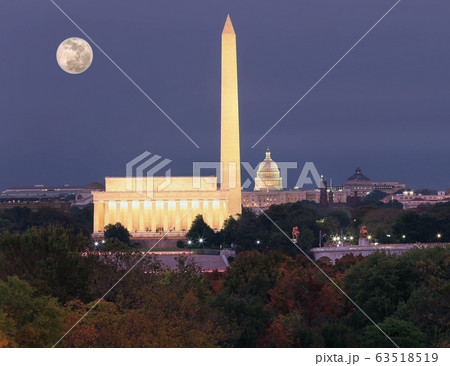 Washington DC skyline at dusk with autumn colorful trees on the foreground, USA 63518519
