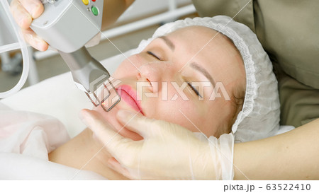 pretty lady lies and therapist makes laser hair removal 63522410