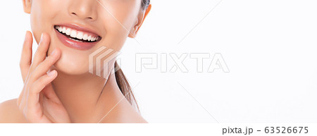 Beautiful smile young woman. White teeth on white Beautiful smile young woman. White teeth on white 63526675