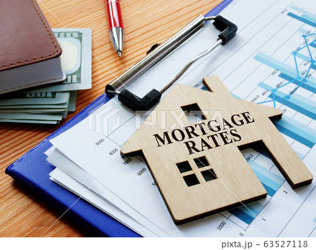 Mortgage rates sign on the home and charts. 63527118