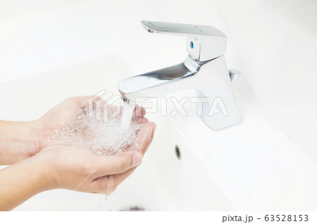 Men are washing their hands every time before eating 63528153