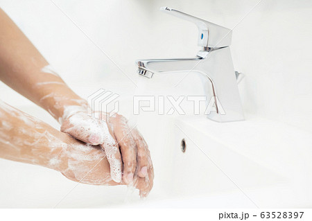 Men are washing their hands every time before eating Men are washing their hands every time before eating 63528397
