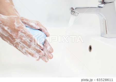 Men are washing their hands every time before eating Men are washing their hands every time before eating 63528611