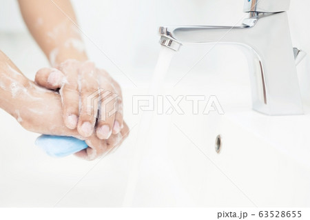 Men are washing their hands every time before eating 63528655
