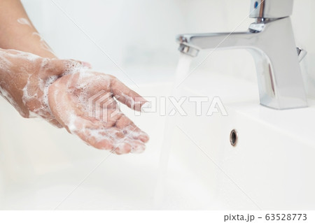 Men are washing their hands every time before eating Men are washing their hands every time before eating 63528773