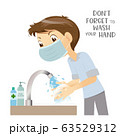 Man wears medical surgical mask washing hand 63529312